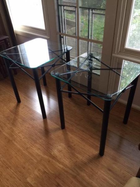 A set of glass top tables