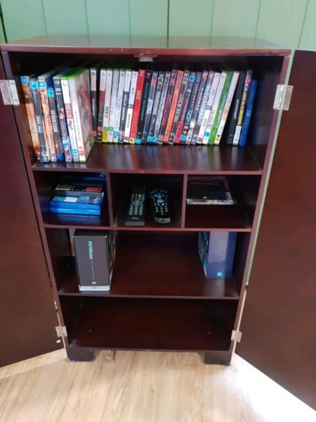 cupboard for dvds and games . Items are not not included