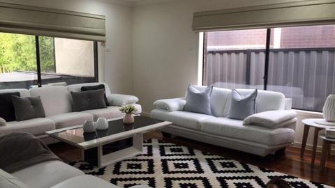 White Leather Couches with coffee table