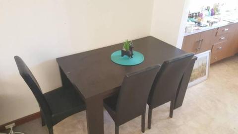 Table and x4 chairs, black leather look couch