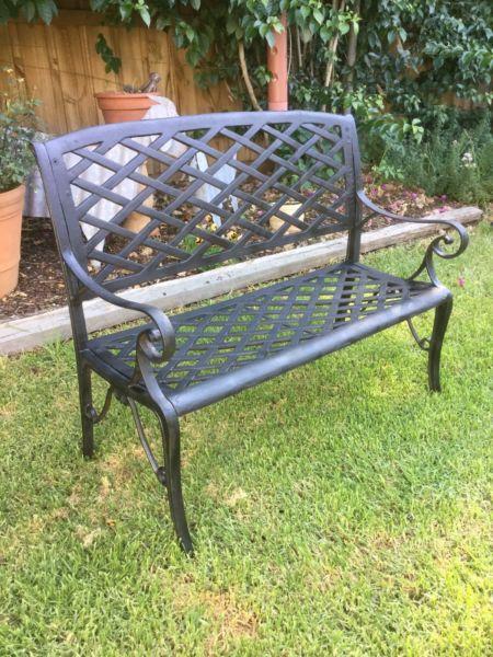 Cast iron garden bench. Wrought iron outdoor seat. Heavy 2 seater