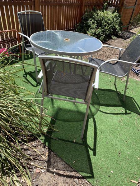 Outdoor glass top table and 3 chairs