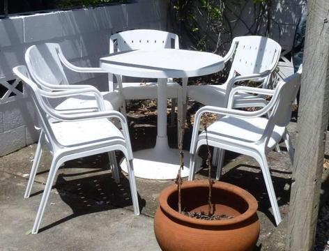White outdoor table and chairs