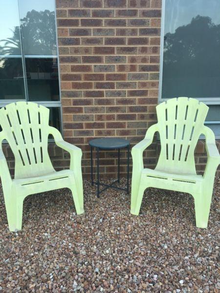 Outdoor plastic deck chairs and table