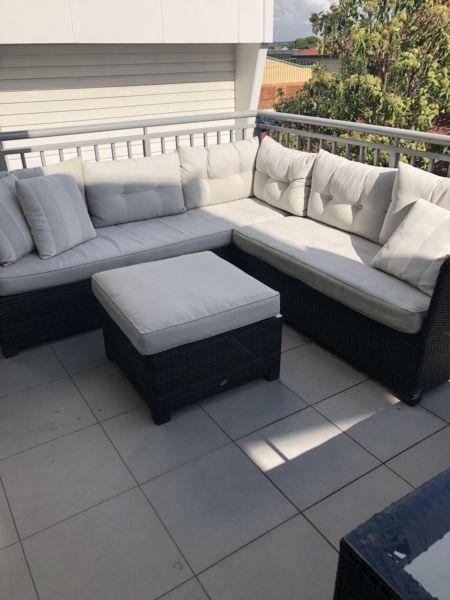 Outdoor wicker corner sofa and table/foot rest