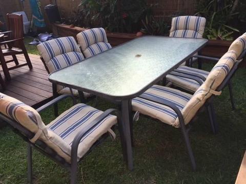 Outdoor table and 6 chairs in fair condition