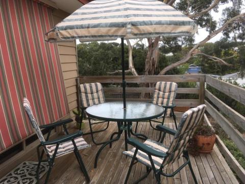 Outdoor setting, round table, 4 chairs and umbrella