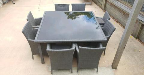 Glass top 8 seater outdoor wicker dining table