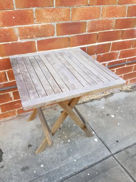 Folding outdoor wooden table
