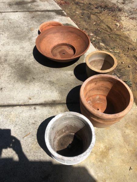 4 pots and a pot holder, terra-cotta, concrete and ceramic