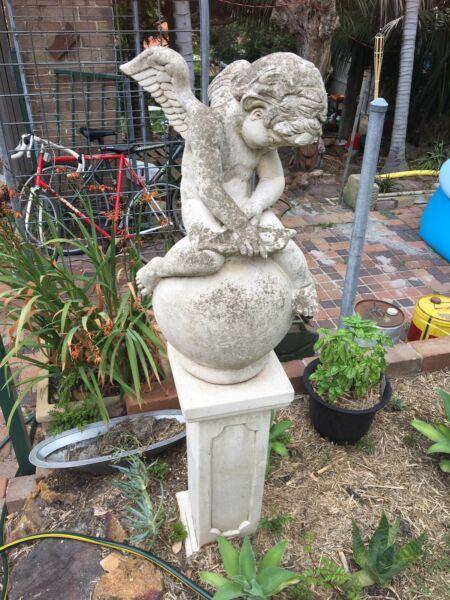 Cherub garden statue on pedestal