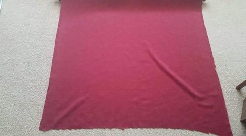 Roll of burgundy coloured upholstery fabric 137cms wide