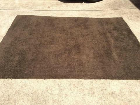 Shaggy chocolate brown floor rug