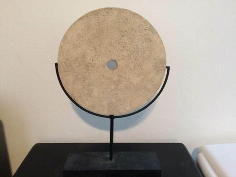 White Stone Coin on Metal Stand