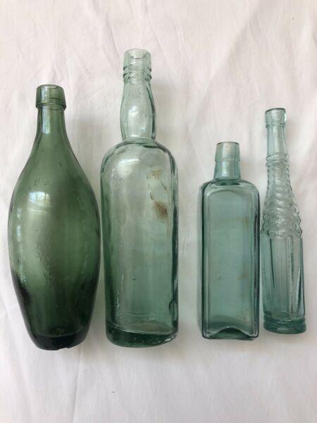 Vintage green bottle collection. Set of 4