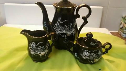 Asian style teapot milk jug and sugar bowl with dragon motif