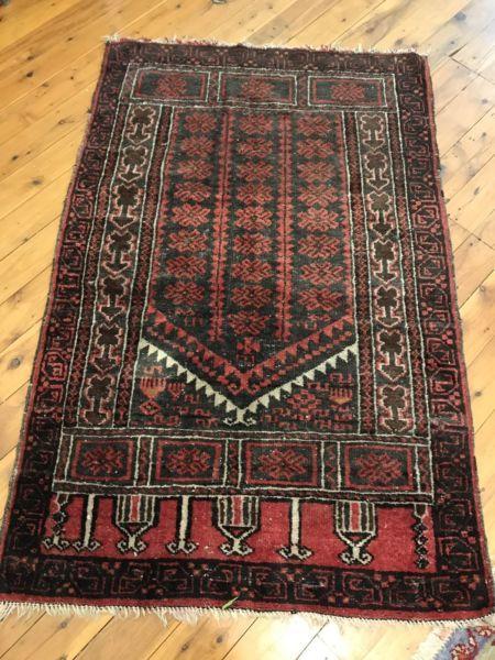 Aged Persian rug