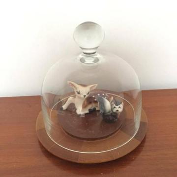 Glass cloche with vintage ceramic animals