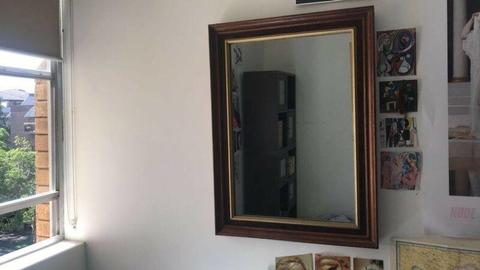 Medium sized mirror with wooden frame
