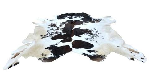 EXOTIC LARGE COW HIDE RUG. BLACK AND WHITE