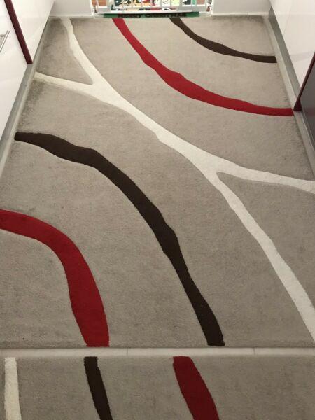 Price Dropped! Red, brown and grey carpet in excellent condition