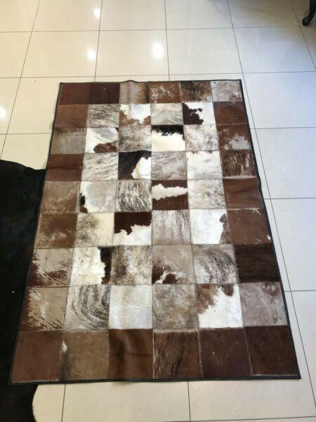 Cow hide patch work rug and cussion covers