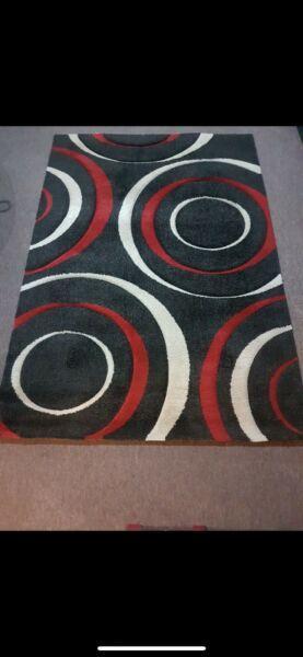 Black, red, white rugs