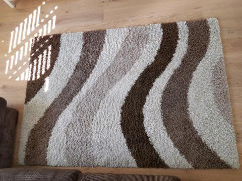 Brown and cream coloured shag rug