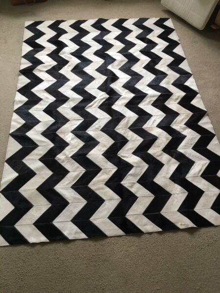 Black and white cow hide rug