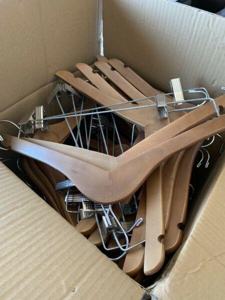 Large box of wooden hangers