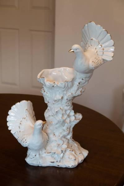 white and gold vase with 2 birds