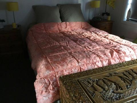 Queen pure wool quilt with satin apricot on top