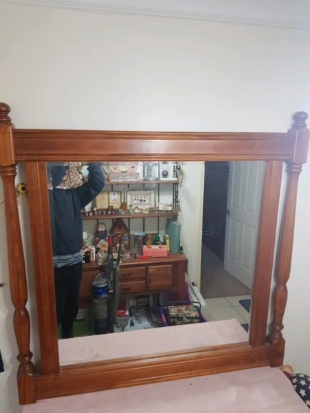 Mirror with ornate timber framing