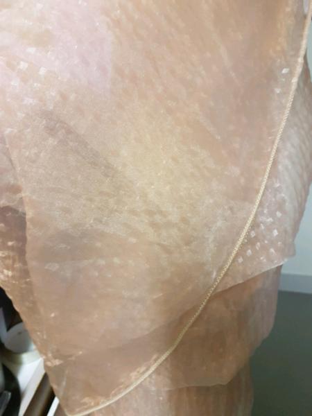 large roll of embossed organza fabric