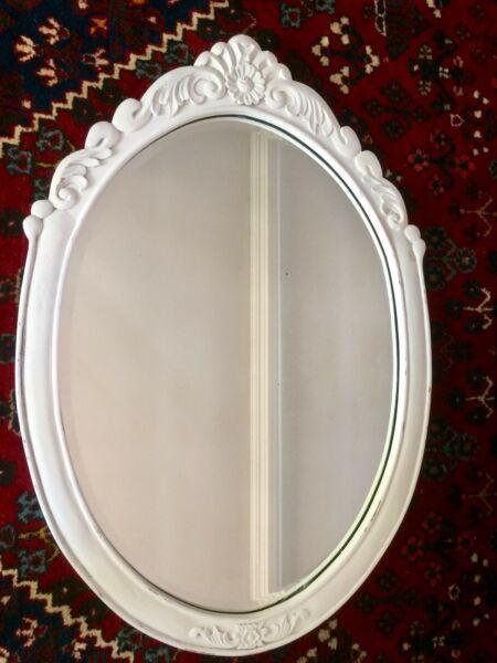 Carved wooden oval wall mirror