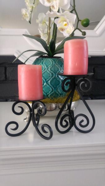 A set of candle stands filigree with candles