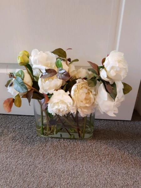 Artificial roses in vase