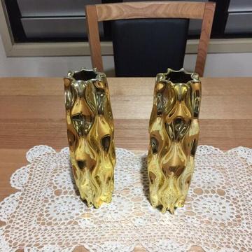 Gold flower vases, tea light holders and table numbers