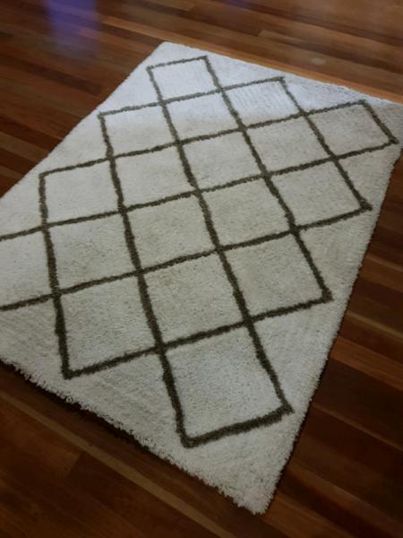 White and brown floor rug mat