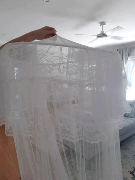 Gorgeous bed canopies which double as mosquito nets!