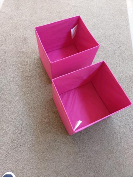 Two collapsible IKEA storage boxes