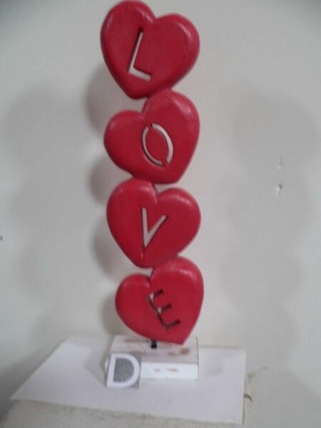 wooden hearts statue with love
