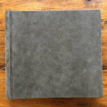 Photo album. Holds 200 photos. Brown faux suede finish