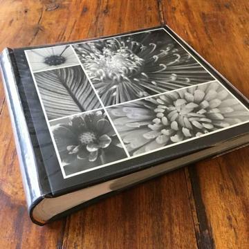 Photo album. Nice and compact. Holds 200 photos. NEW