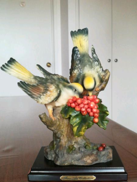 Birds on tree with red berries ornament