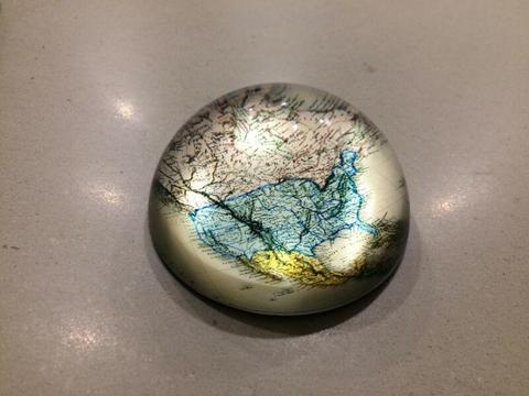 Glass paperweight with map of North America