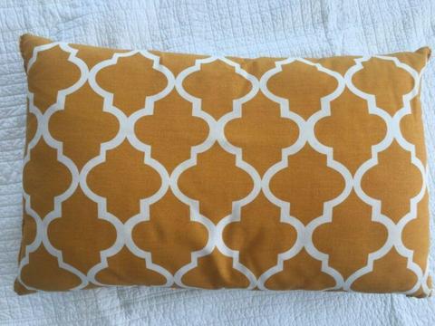 Yellow and white cushion in good condition