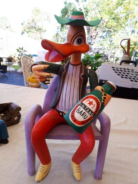 70s wooden duck sitting on chair with drink moveable body parts