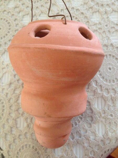 Hanging terracotta candle