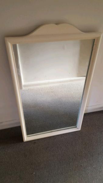 Wall mirror with thick wooden frame